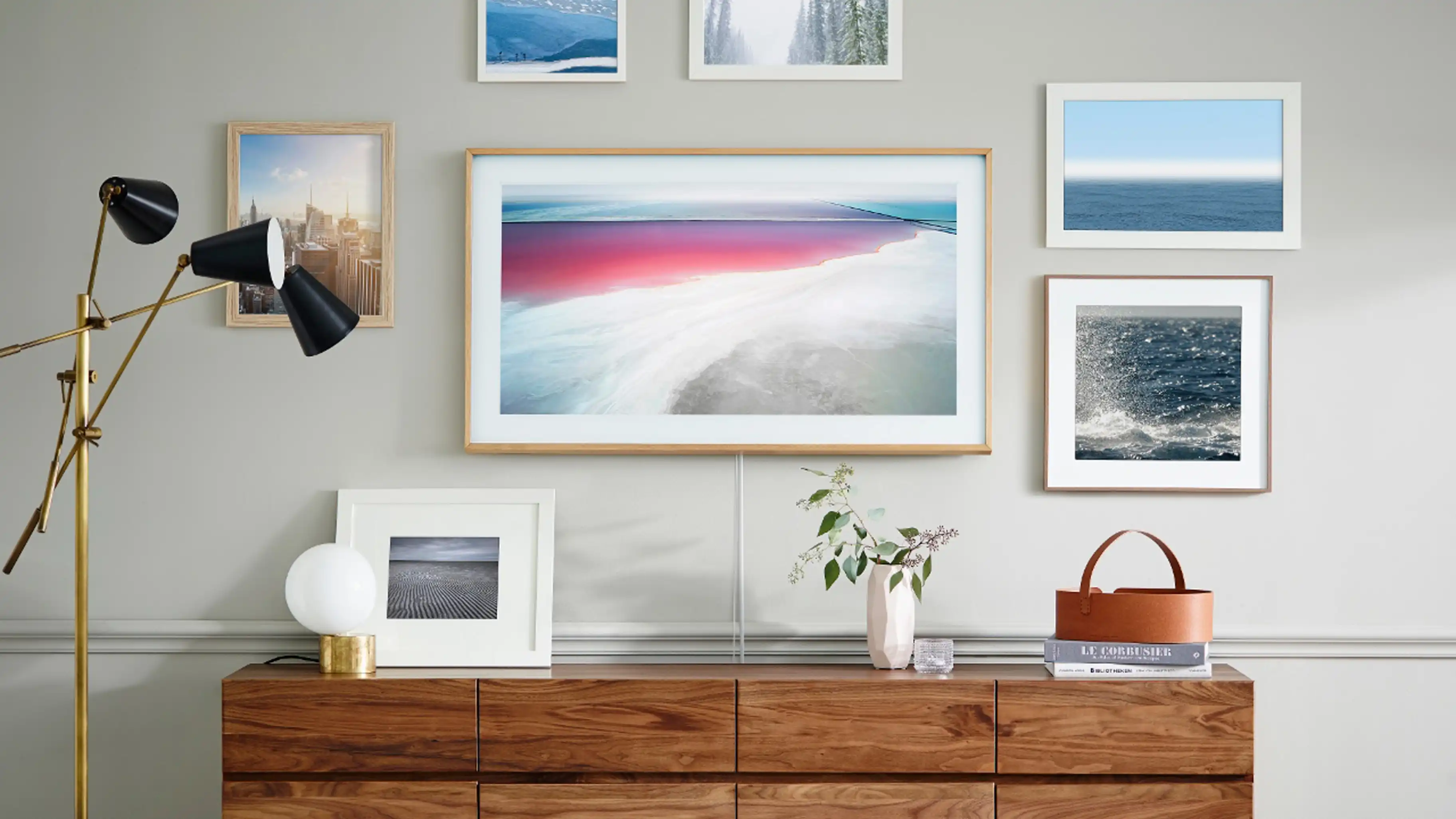 Samsung Frame TV displaying artwork in modern living room setting, seamlessly blending with home decor
